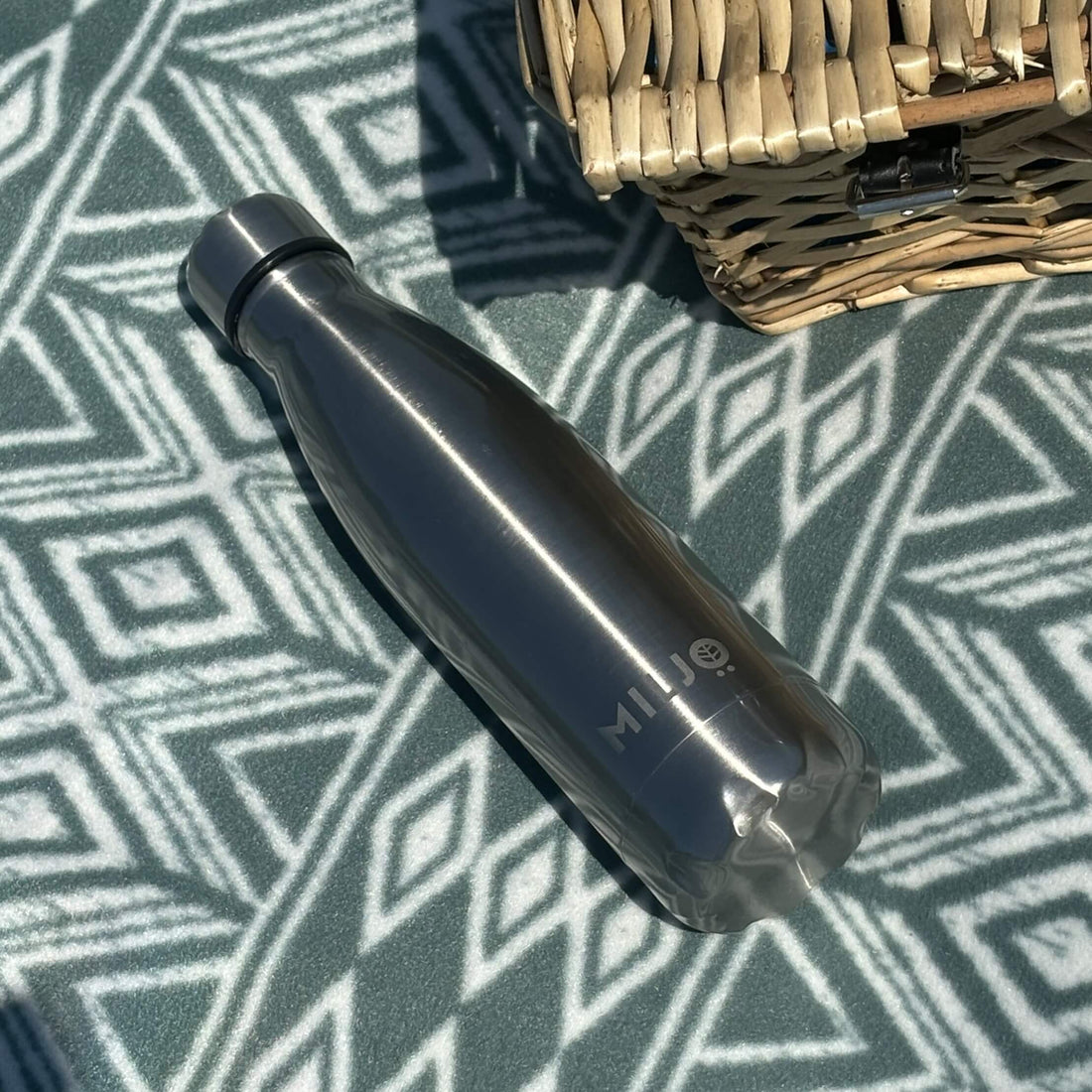 grey water bottle with picnic hamper